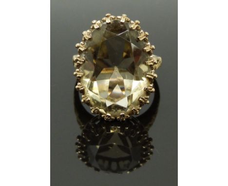 A 9ct gold ring set with a large oval cut quartz, size R, 7.91g