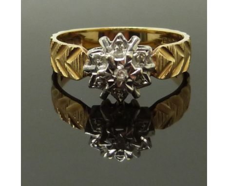 A 9ct gold ring set with a diamonds with textured detail to the shoulders, size M, 2.63g&nbsp;