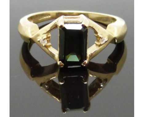 A 9ct gold ring set with an emerald cut tourmaline and diamonds, size M/N, 3.36g