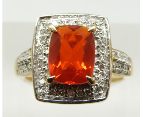 A 9ct gold ring set with a cushion cut Salamanca fire opal and diamonds, 4g, size M