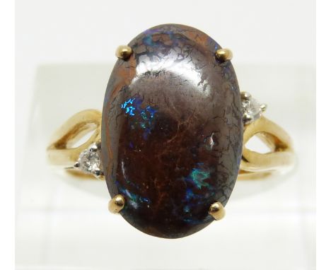 A 9ct gold ring set with a large boulder opal, 3.8g, size N