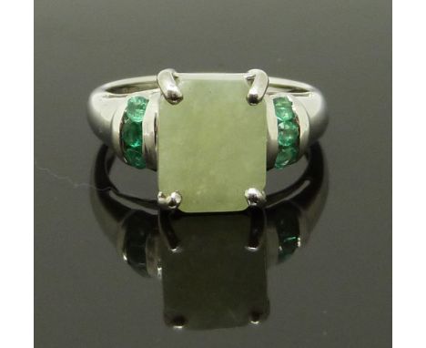 A 9ct white gold ring set with a hardstone and emeralds, size J, 3.09g&nbsp;