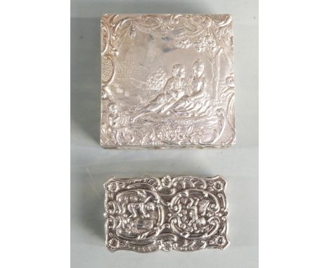 Two modern hallmarked silver trinket boxes, both with embossed decoration, one depicting a courting couple, length of larger 