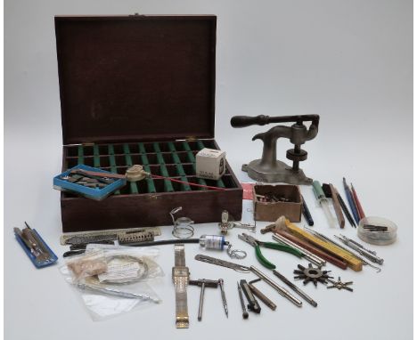 A collection of watch maker's tools, eye glasses etc together with a wooden fitted pocket watch collector's/repairer's case a