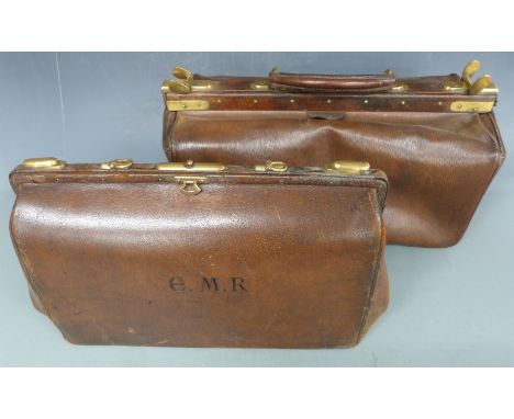 Two vintage brown leather Gladstone bags with brass fittings, largest 22 x 45cm
