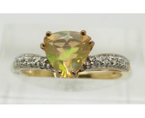 A 9ct gold ring set with a trilliant cut opal and diamonds, 1.7g, size M