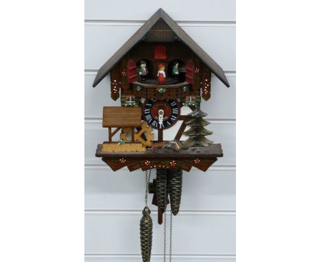 Swiss made 20thC three train cuckoo clock with musical movement on the hour and half hour and waterwheel and dancers automato