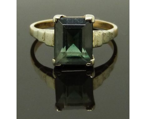 A 9ct gold ring set with an emerald cut topaz, size N/O, 3.47g&nbsp;