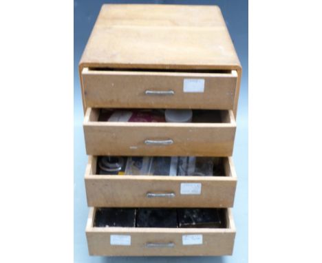 Four drawer clock repairer's cabinet containing parts and some tools, H32 x W26 x D30cm