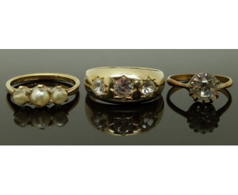 A 9ct gold ring (2.5g), a silver gilt ring set with paste and another ring, size J, N &amp; R