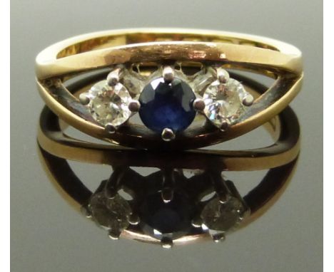 An 18ct gold ring set with a sapphire and two diamonds, each approximately 0.18ct, 5g, size N