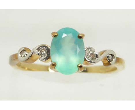 A 9ct gold ring set with an oval cut Paraiba opal and diamonds, 1.6g, size M