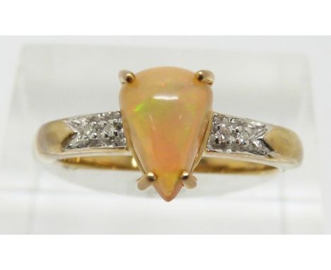 A 9ct gold ring set with a pear cut Indonesian opal and diamonds, 2.8g, size N