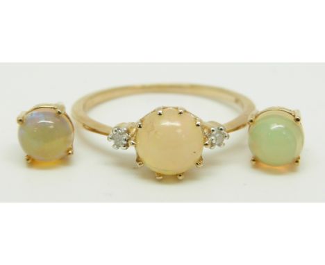 A 9ct gold ring set with a round Ethiopian opal cabochon and two diamonds with similar earrings, 2.7g, size R