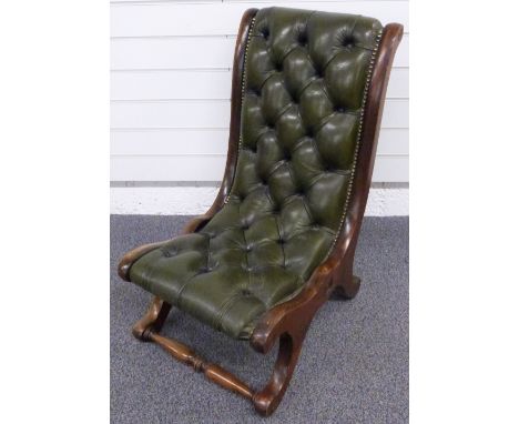 Leather Chesterfield style button backed nursing chair with shaped mahogany frame