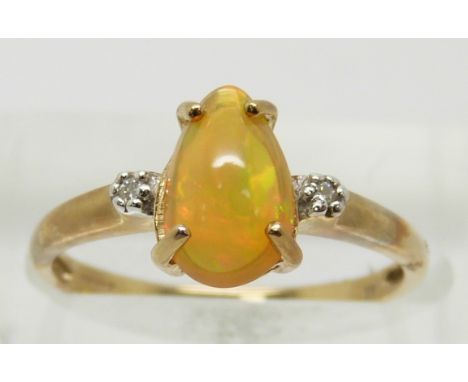 A 9ct gold ring set with a pear cut opal and diamonds, 1.9g, size N