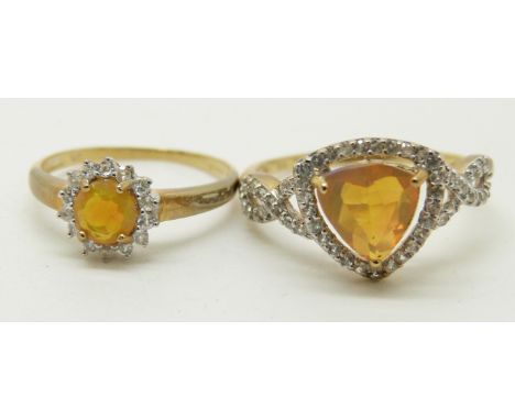 Two 9ct gold rings set with an Indonesian trilliant cut opal surrounded by zircons, and a 9ct gold ring set with a round cut 