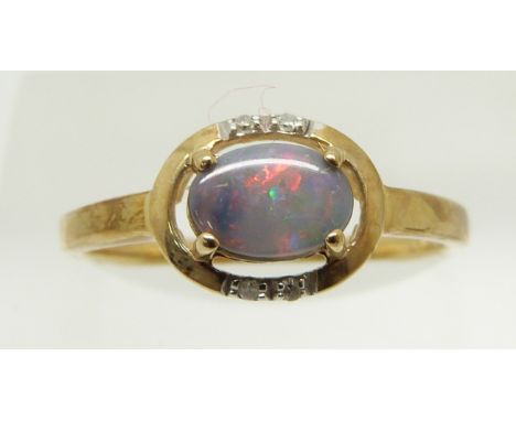 A 9ct gold ring set with an oval black opal cabochon and diamonds, 1.6g, size N