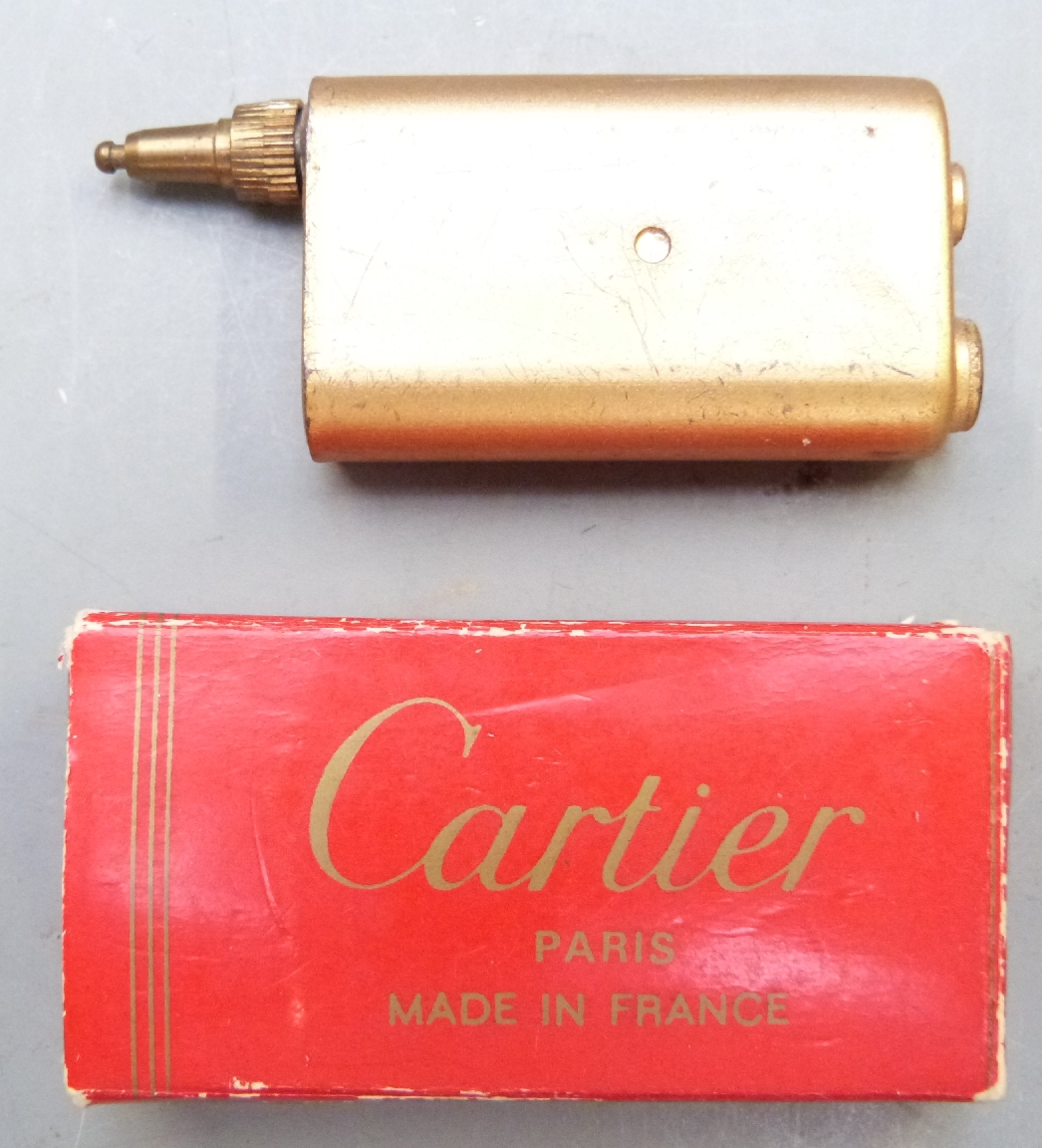 Cartier gold plated gas lighter with guarantee and paperwork, in