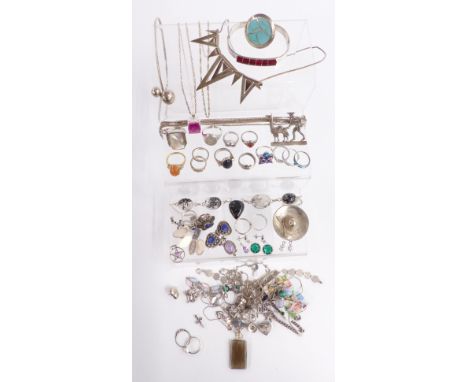 A collection of silver jewellery including snake ring, other rings, necklaces, bangle and earrings&nbsp;