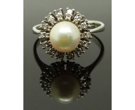 An 18ct white gold ring set with a pearl surrounded by diamonds, size R, 4.89g&nbsp;