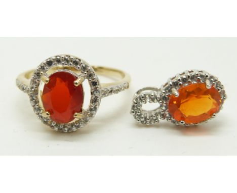 A 9ct gold ring set with an oval cut fire opal and a 9ct white gold pendant set with an oval cut fire opal and diamonds, 3.4g