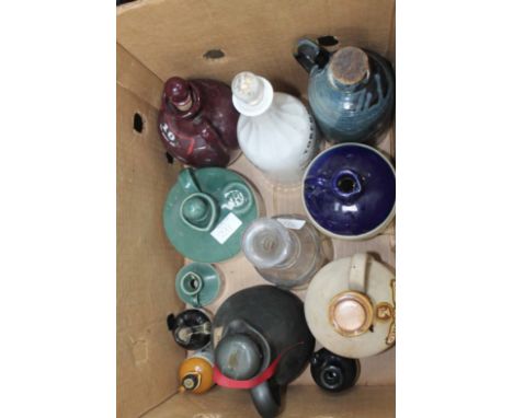 LARGE LOT OF EMPTY CERAMIC WHISKY DECANTERSAlso a print of a matador
