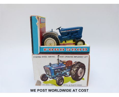 Britains Ltd diecast model Ford Super Major 5000 Diesel Tractor with blue body and white plastic hubs, in original box