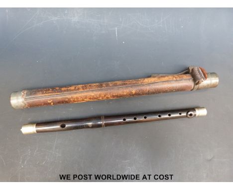A military rosewood fife with white metal mounts in leather bound case. The mount engraved with GrR.7.1907 1B.4.k.111