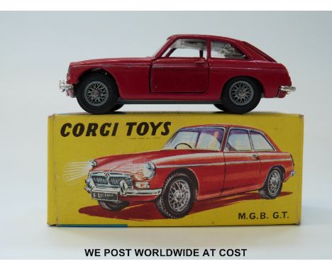 Corgi Toys diecast model MGB GT, 327, with dark red body, pale blue interior, spoked wheels and suitcase, in original box wit