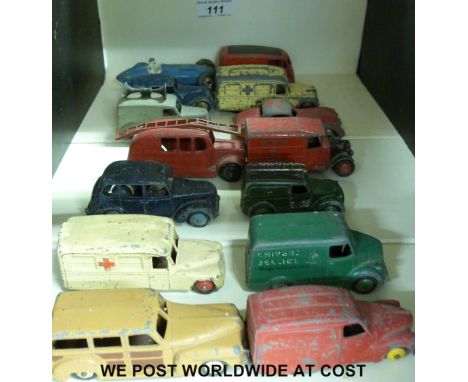 Fourteen Dinky Toys diecast model vehicles including delivery vans, racing car, fire engine, ambulance, etc