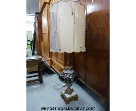 A large 19thC style brass and ceramic lamp (Height 110cm)