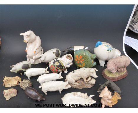 A collection of pig ornaments including a Carlton Ware pig jug, Beswick, Studio pottery, Border Fine Arts, Retro Sadler etc