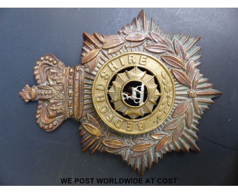 A large Bedfordshire Regiment helmet badge