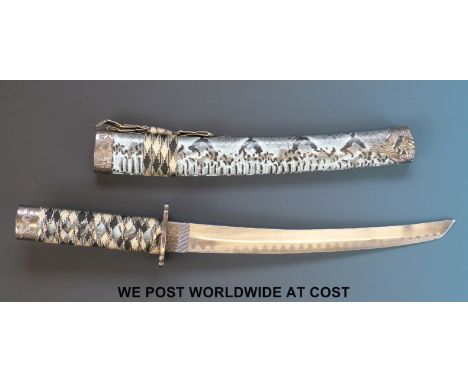 A Japanese wakizashi short sword with faux snake skin scabbard. 