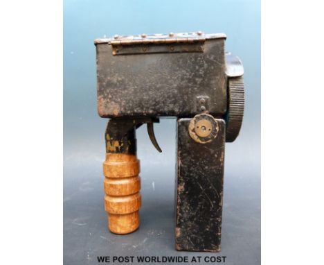 An Admiralty pattern 1038 signalling lantern with trigger mechanism and five various lenses