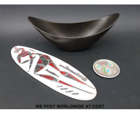 A long oval ceramic plaque in the manner of Picasso and two Poole pottery items