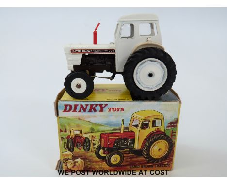 Dinky Toys diecast model David Brown Tractor 305, with white body, hubs, and rear attachment, red exhaust, and David Brown Se