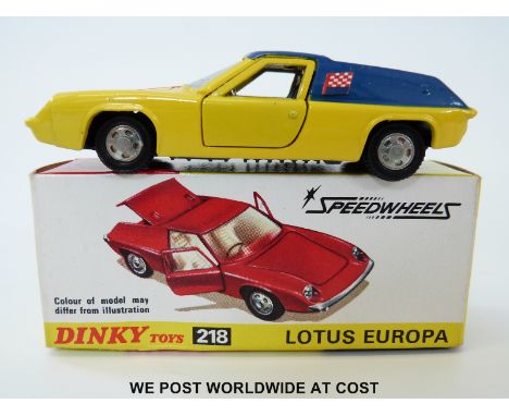 Dinky Toys diecast model Lotus Europa, 218, with yellow body, blue roof and side panels, orange racing stripe, gold engine an