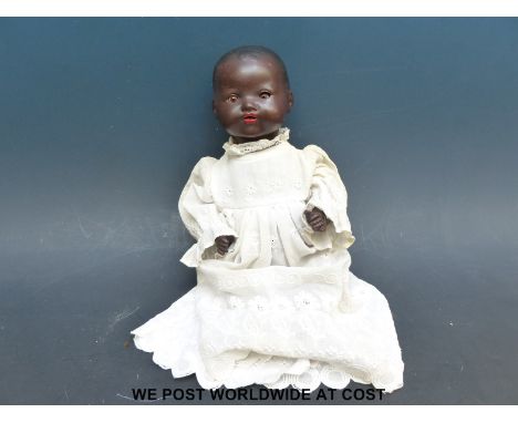 Armand Marseille bisque headed black doll with weighted brown eyes, open mouth, moulded hair and jointed composition body, in