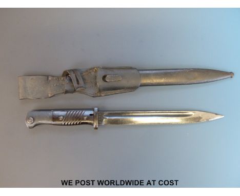 A 1940 Nazi German K98 1884/98 bayonet by Jacobs and Co, the 25cm fullered blade stamped 'J. Sch', matching numbers 5785, bla