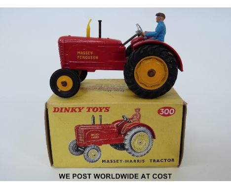 Dinky Toys diecast model Massey-Harris Tractor, 300, with red body, yellow hubs and exhaust and driver, named Massey-Ferguson