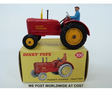 Dinky Toys diecast model Massey-Harris Tractor, 300, with red body, yellow hubs and exhaust and driver, named Massey-Ferguson