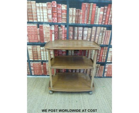 A light elm Ercol tea trolley (length 72cm)