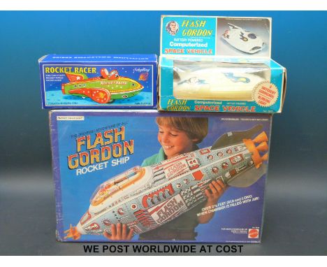 A 1978 Flash Gordon battery operated computerized Space Vehicle together with a Schylling Rocket Racer and a 1979 Mattel Flas