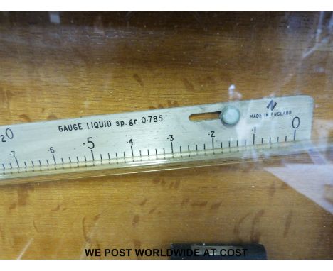 A Negretti & Zambra liquid gauge together with a brass thermometer in a wooden case