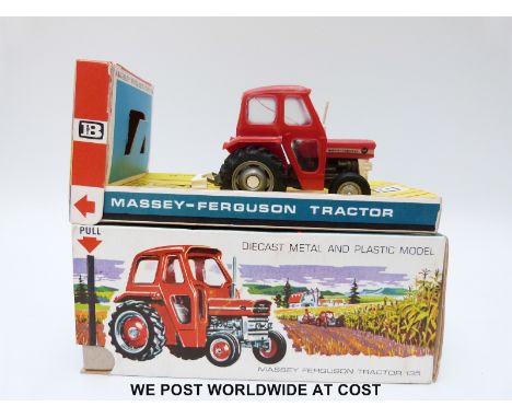 Britains Ltd diecast model Massey-Ferguson 135 Tractor with red and white body and removable safety cab, in original box with