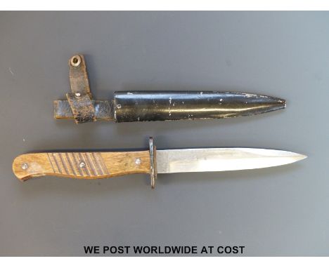 A WWI close combat German trench fighting knife, made by ERN, with 5½ inch clean single edged blade, the handle with grooved 