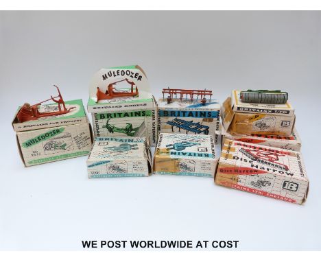 Eight Britains Ltd model farm implements, two Three Furrow Ploughs 9530, Farm Roller 9533, Disc Harrow 9534, Two MuleDozers 9