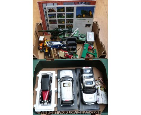 A collection of Franklin Mint, Britains and other diecast model vehicles together with brass desk cannon, tractor calendars e